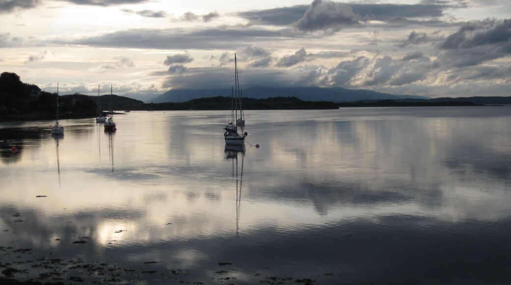 Moored Yachts Moored in bay near Connel Bridge. Island of Mull in the background.