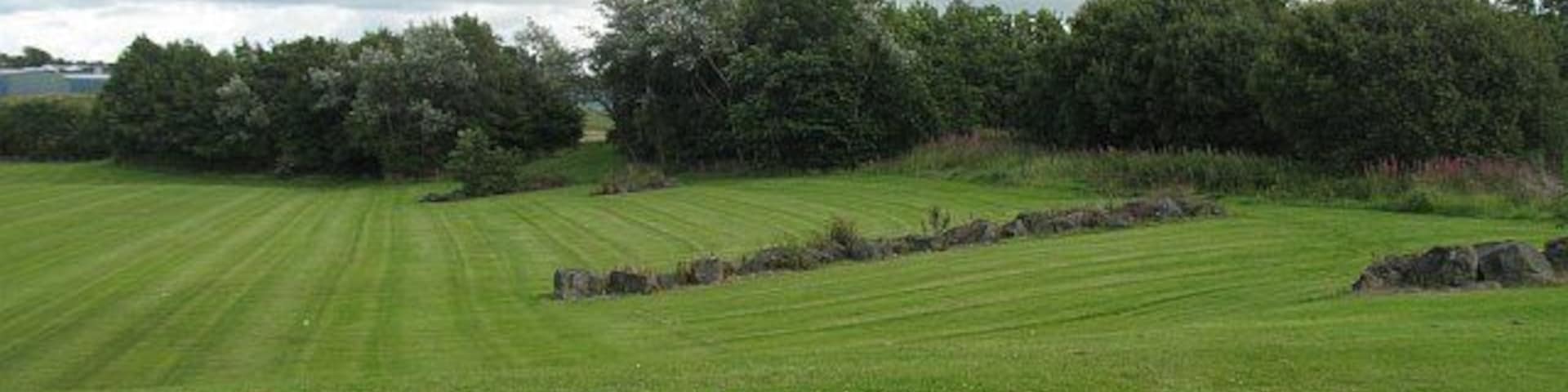 Landscaping, Glengarnock Rows of boulders above the rugby pitch.