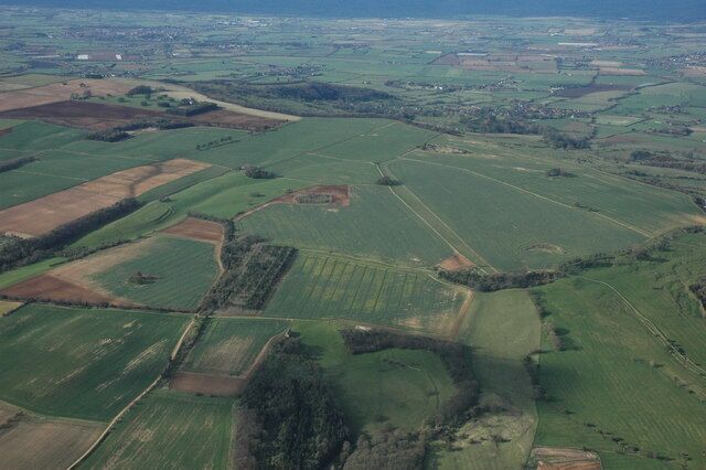 Bredon Hill from the air Bredon Hill is the largest of the Cotswold outliers and covers many grid squares, the hill is 299 metres above sea level at its highest point, though its height is lost in this view. The earthworks of Conderton Hillfort can be seen to the left of centre.