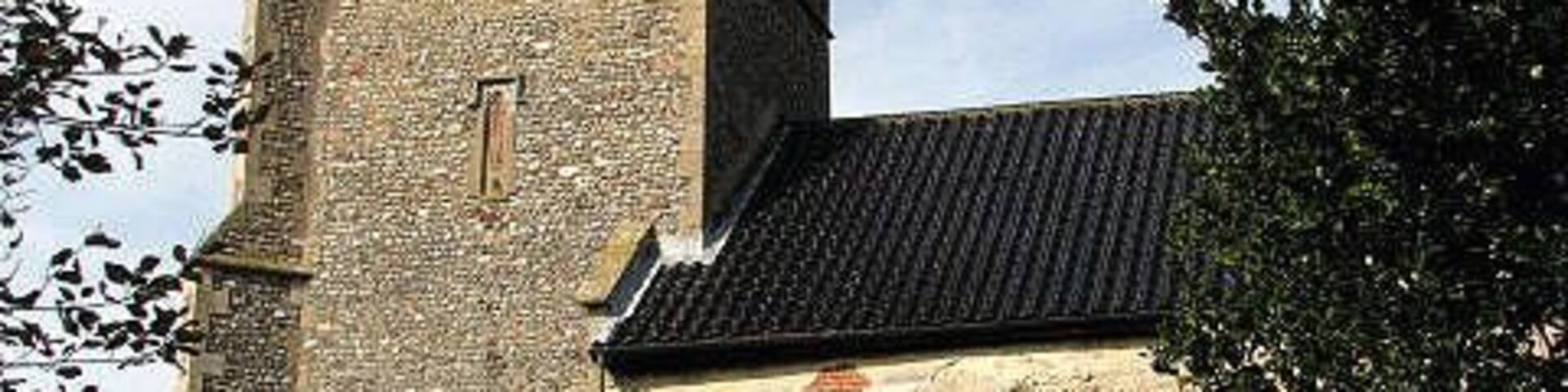 St Mary's church - porch and tower. St Mary's church has a late medieval tower and a Saxon doorway; the chancel dates from the late 13th century as is evidenced by the angle piscina > 831132 which is still in place. The interior was, however, extensively restored in the 19th century; medieval survivals are the C15 font, carved with arms of the Valoines family > 831134 and the original roof > 831127 - dating from the same time. The church is open every day. For more information see: http://www.norfolkchurches.co.uk/barney/barney.htm