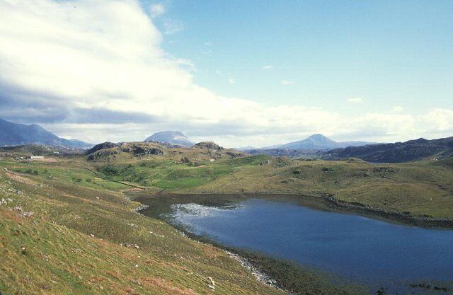 Loch Sheigra. Inlet off Loch Inchard. Beyond from left to right - Foinaven, Arkle and Ben Stack.