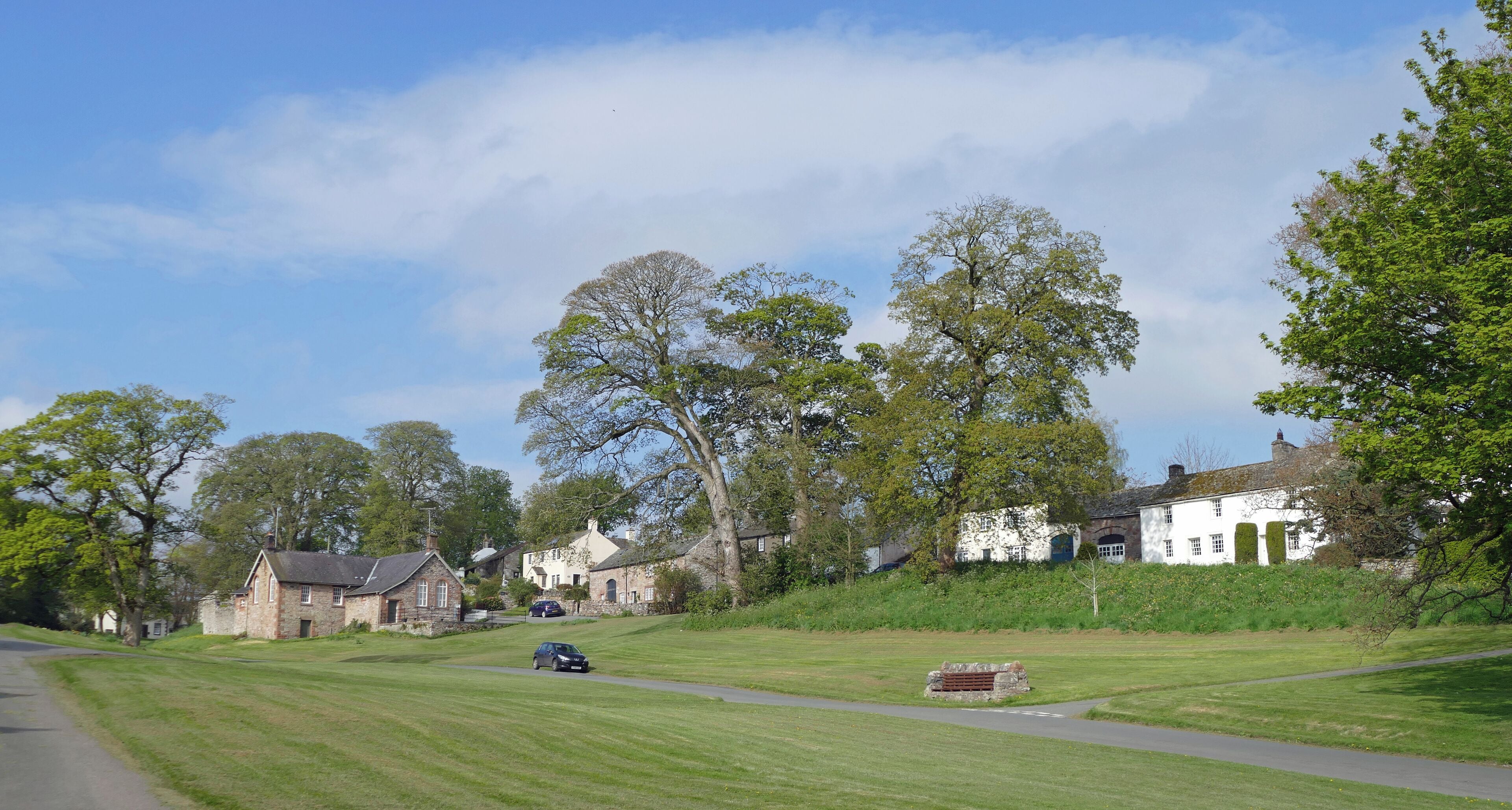 Part of the Lowther estate with the family now living in Askham Hall - Lowther Castle is now a gothic shell not a residence. The upper and lower halves of the village have these extensive and well kept grass lawns.