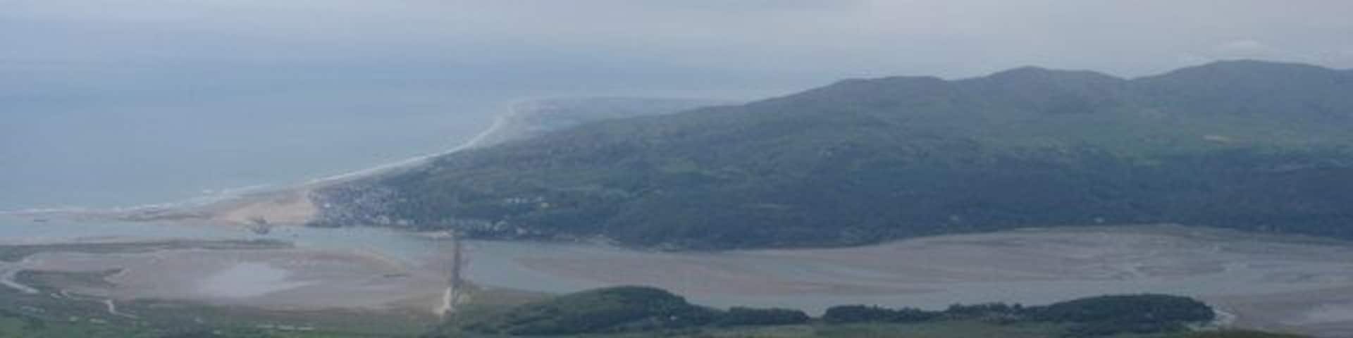 View from Braich Ddu Looking North from the summit of Braich Ddu (546m). Arthog in the middle ground, Barmouth Bridge and Talybont in the distance with the Llyn Peninsula lost in the haze of a hot summer day. 3.15 pm June 2nd 2007.