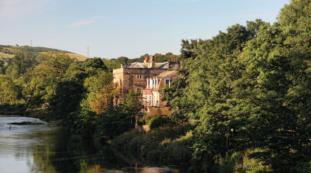 Armathwaite Castle. View from Armathwaite Bridge looking up the River Eden to Armathwaite Castle.