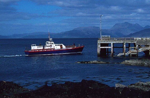 Armadale Pier, Isle of Skye. Armadale Pier before it was altered in 1994 to create a linkspan for ro-ro car ferry operations. (If the photo were taken today, you'd almost be standing on the linkspan (ramp) leading down to the car ferry.) The boat is the Shearwater which was the passenger ferry from Arisaig to the Small Isles from the '70s. The "Shearwater" started life as a Harbour Defence Vessel and was used in the D Day landings, she remained in active service until 1958. A new Shearwater is now on that run.