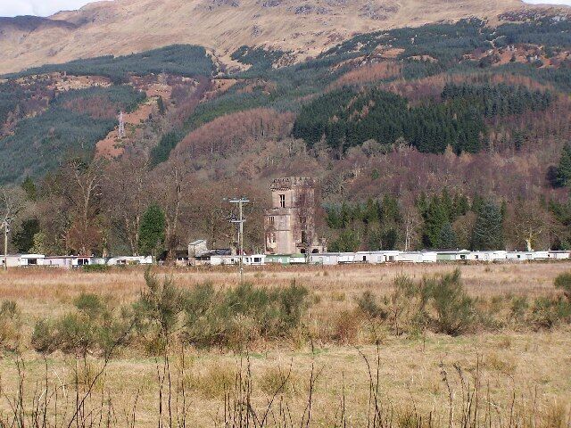 Glenfinart caravan site. Shows the ruined front of Glenfinart House (HMS Armadillo) which was the RN HQ in 1943. The house was destroyed by fire in 1968. The house was requisitioned during World War II, and designated HMS Armadillo. Initially used as a War Office camp, it transferred to the Royal Navy in 1942, and provided training facilities for RN Beach Commandos.