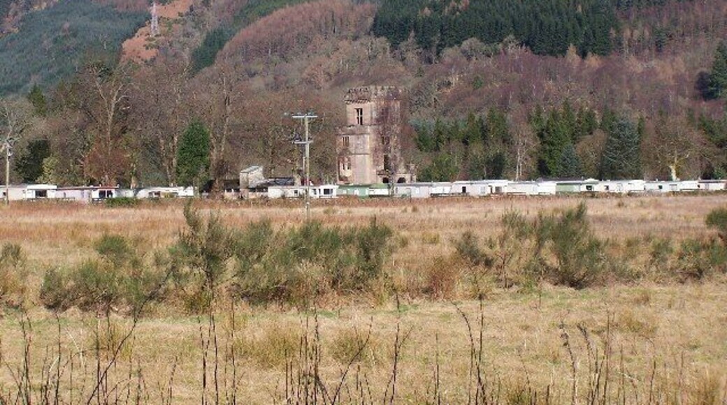 Glenfinart caravan site. Shows the ruined front of Glenfinart House (HMS Armadillo) which was the RN HQ in 1943. The house was destroyed by fire in 1968. The house was requisitioned during World War II, and designated HMS Armadillo. Initially used as a War Office camp, it transferred to the Royal Navy in 1942, and provided training facilities for RN Beach Commandos.