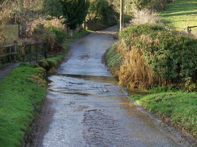 Ford in Sevenhampton The infant River Coln runs across the road.