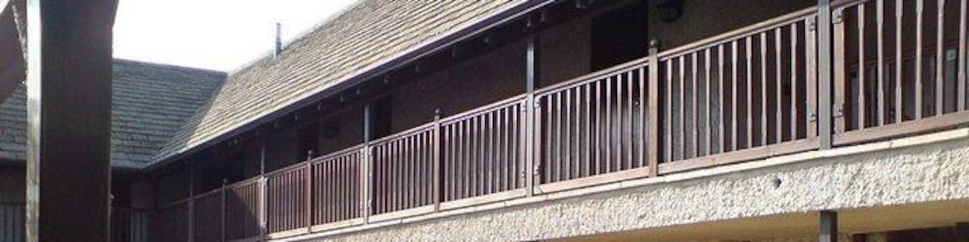 Courtyard, Crown of Crucis Hotel, Ampney Crucis The upstairs bedrooms are approached via the balcony.