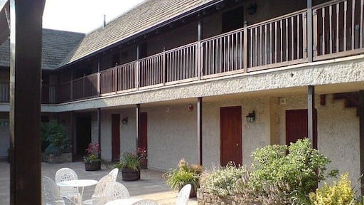 Courtyard, Crown of Crucis Hotel, Ampney Crucis The upstairs bedrooms are approached via the balcony.