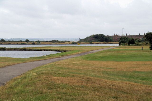 Road to Fort Gilkicker The old military road is now used by the Solent Way. Beware flying golf balls.