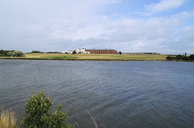 Lake, Gilkicker Point Part of the landward defences of Fort Monckton, seen in the distance.