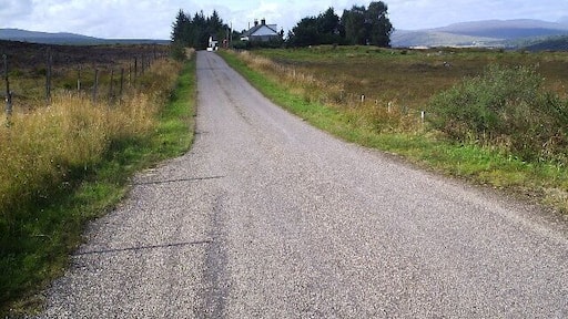 The Old School House. It has a phone box and a mail box! that was the first phone box I saw on this road.