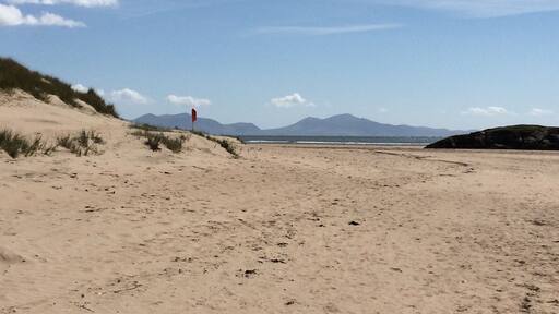 Fantastic and huge beach at Aberffraw backed by acres of sand dunes. Views over to Snowdonia.