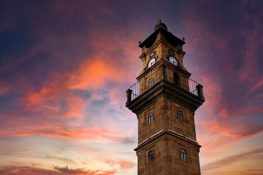 A historical old antique clock tower at sunset. Ottoman period yozgat turkey