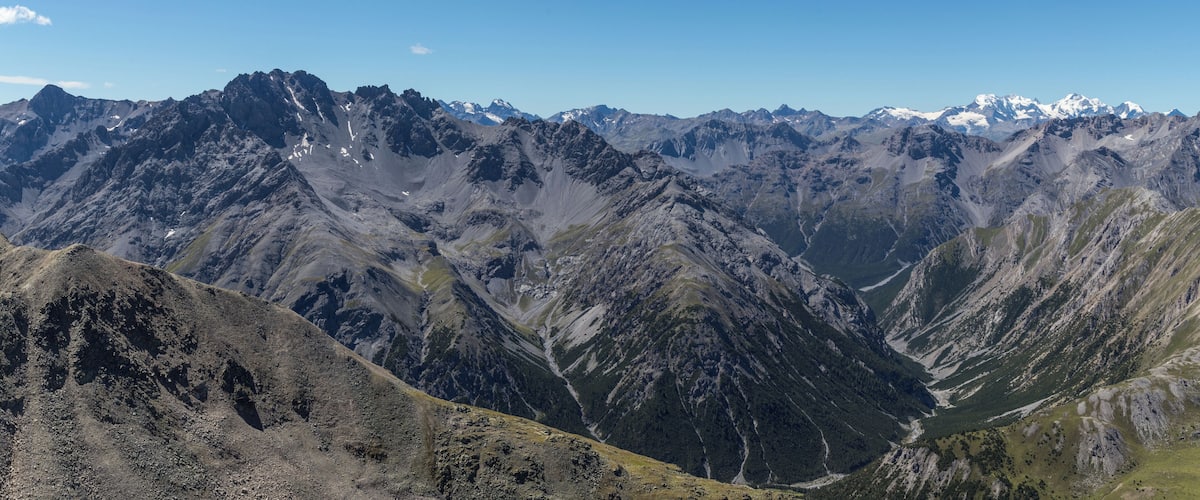 View of Piz Murtaröl (left) and the lower part of Val Mora, seen from Piz Daint; in the background the Bernina massif