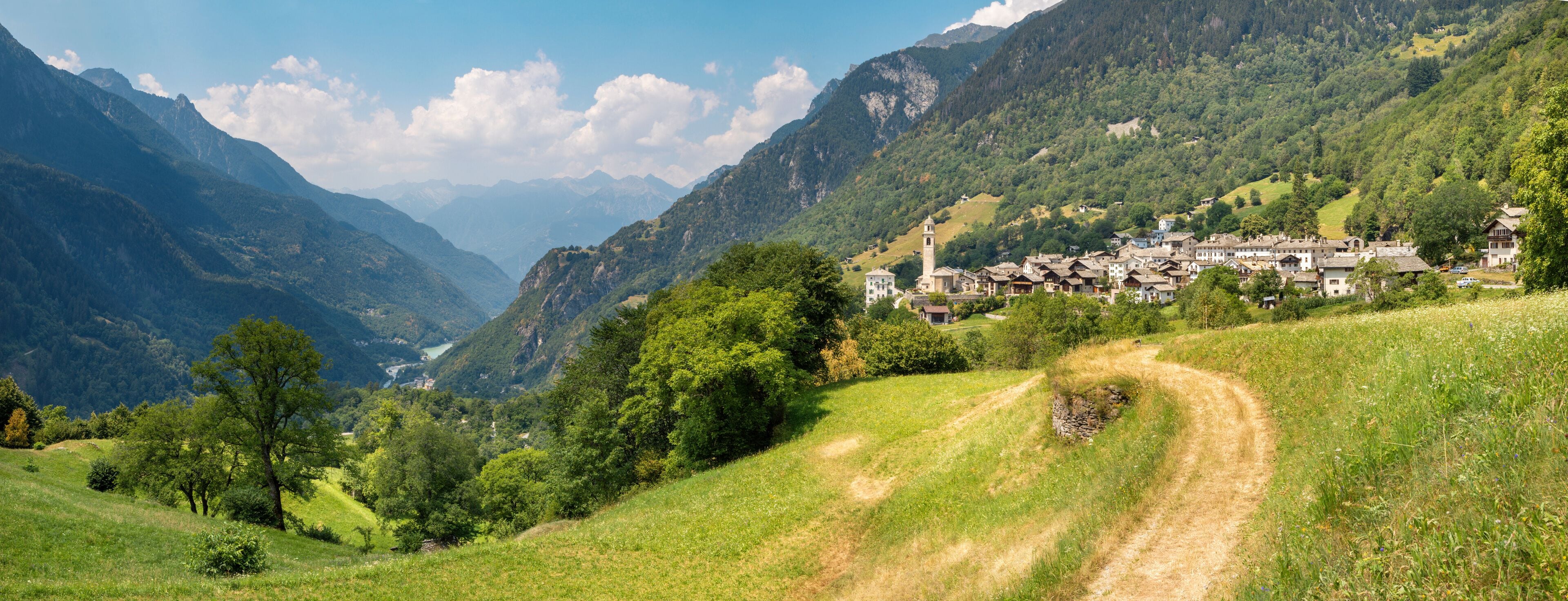 A mountainous landscape with a village nestled among the hills.