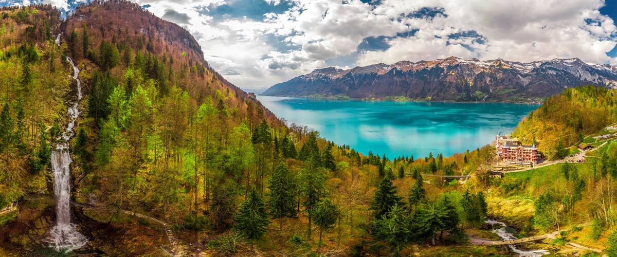 Lake Brienz and Giessbach Waterfall by Interlaken with the Swiss Alps covered by snow, Switzerland