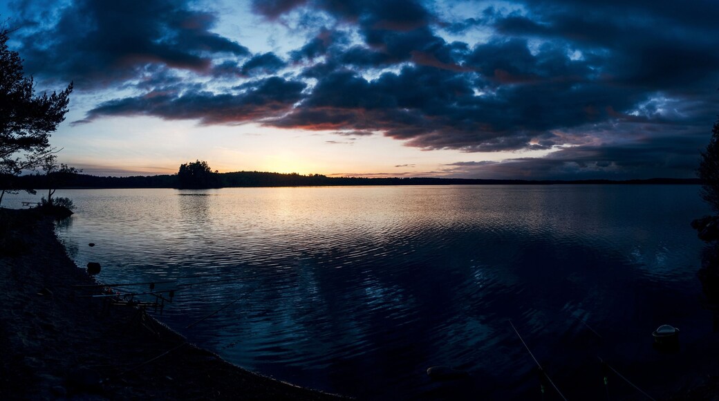 Dark sunset behind clouds over a seascape in Unnaryd, Sweden