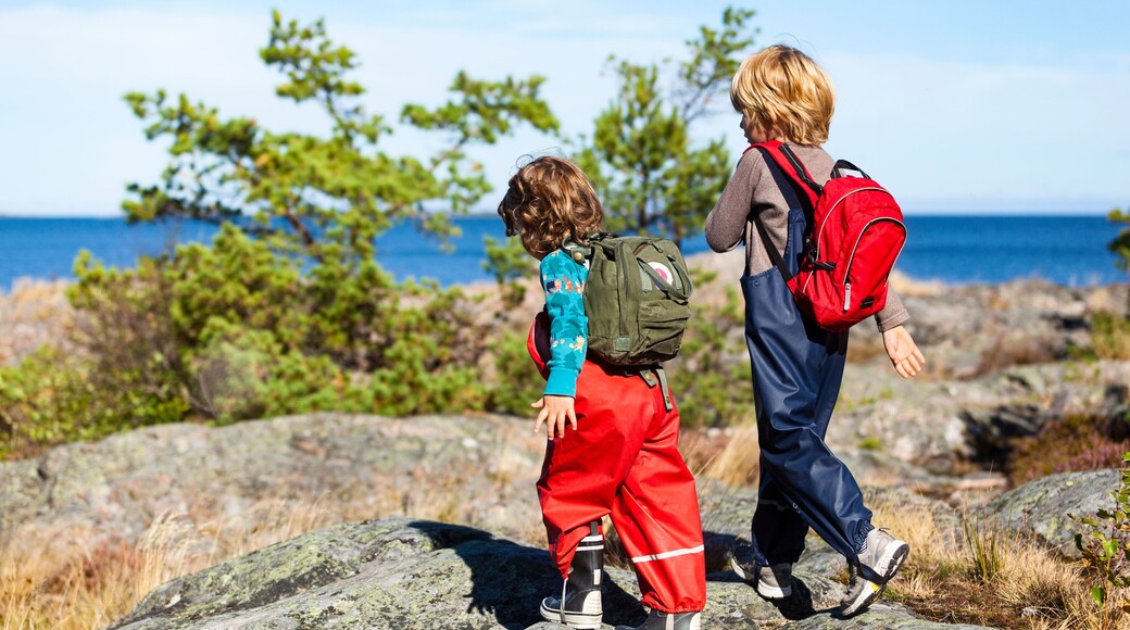 Brother and sister walking at sea
