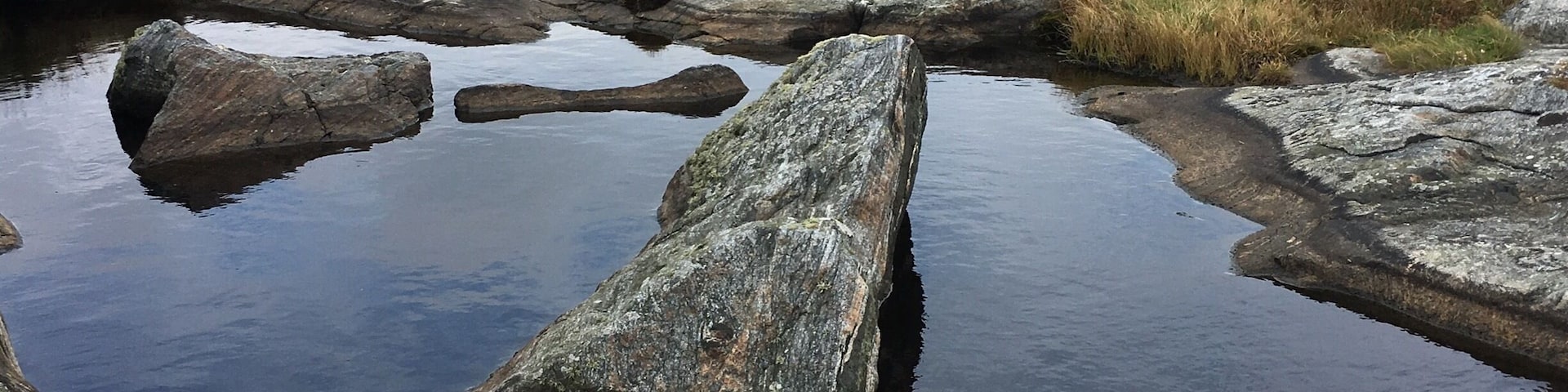 Cross over into Hono by ferry and head west to Ersdalsvagen and the nature preserve. Rock, sea, water and sky.