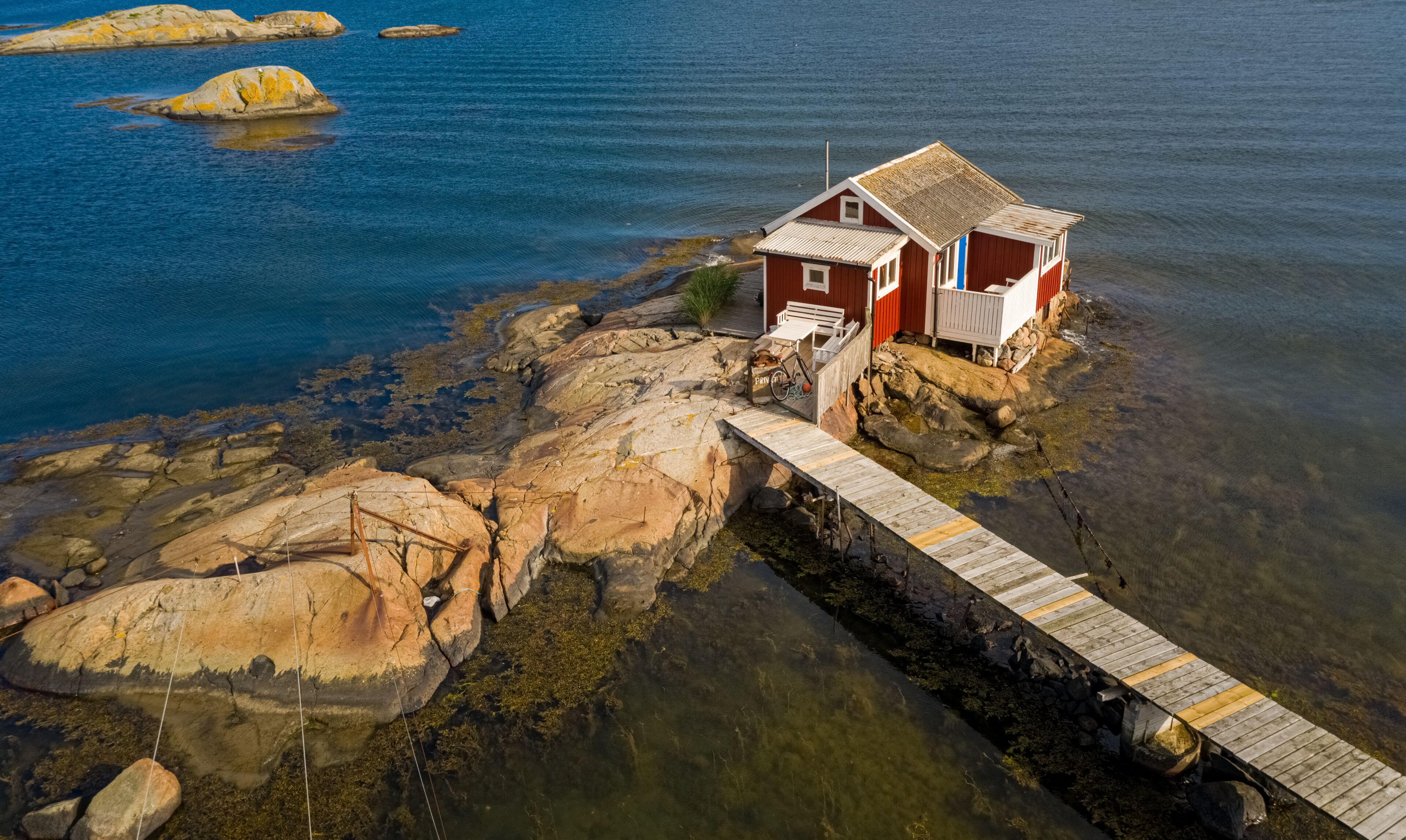 Aerial view of a red cottage , Hönö, Gothenburg archipelago, Sweden.