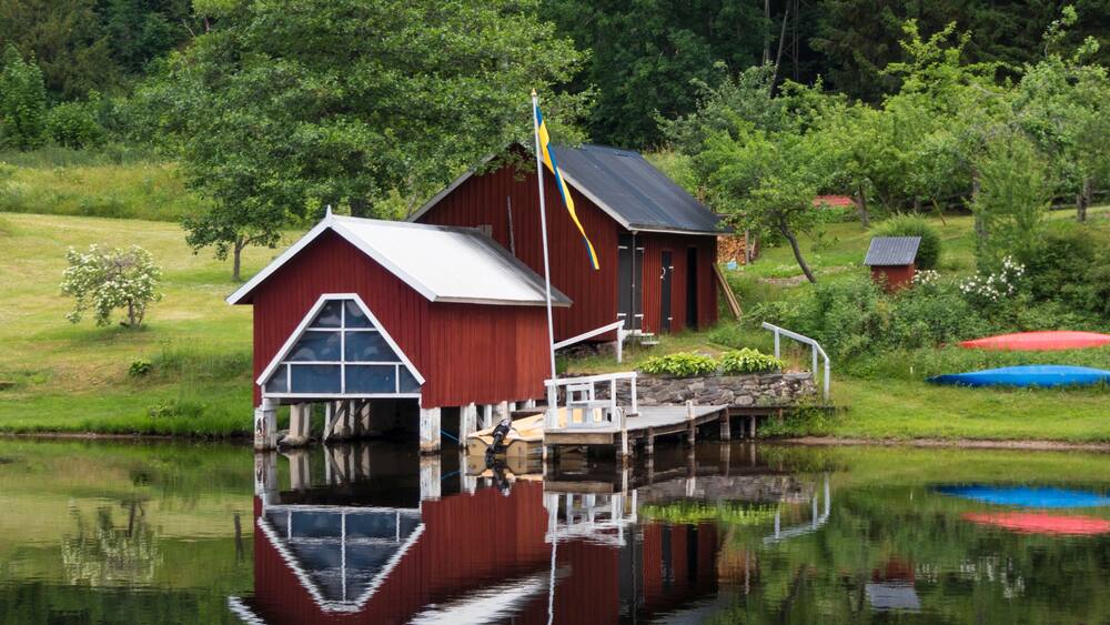 Haverud, Sweden A house is reflected in the water along the Dalsland Canal in western central Sweden on a bridge.