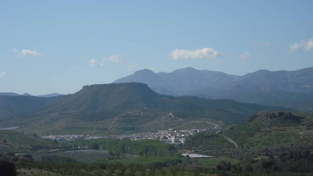 A mountainous landscape with a town nestled in the valley.