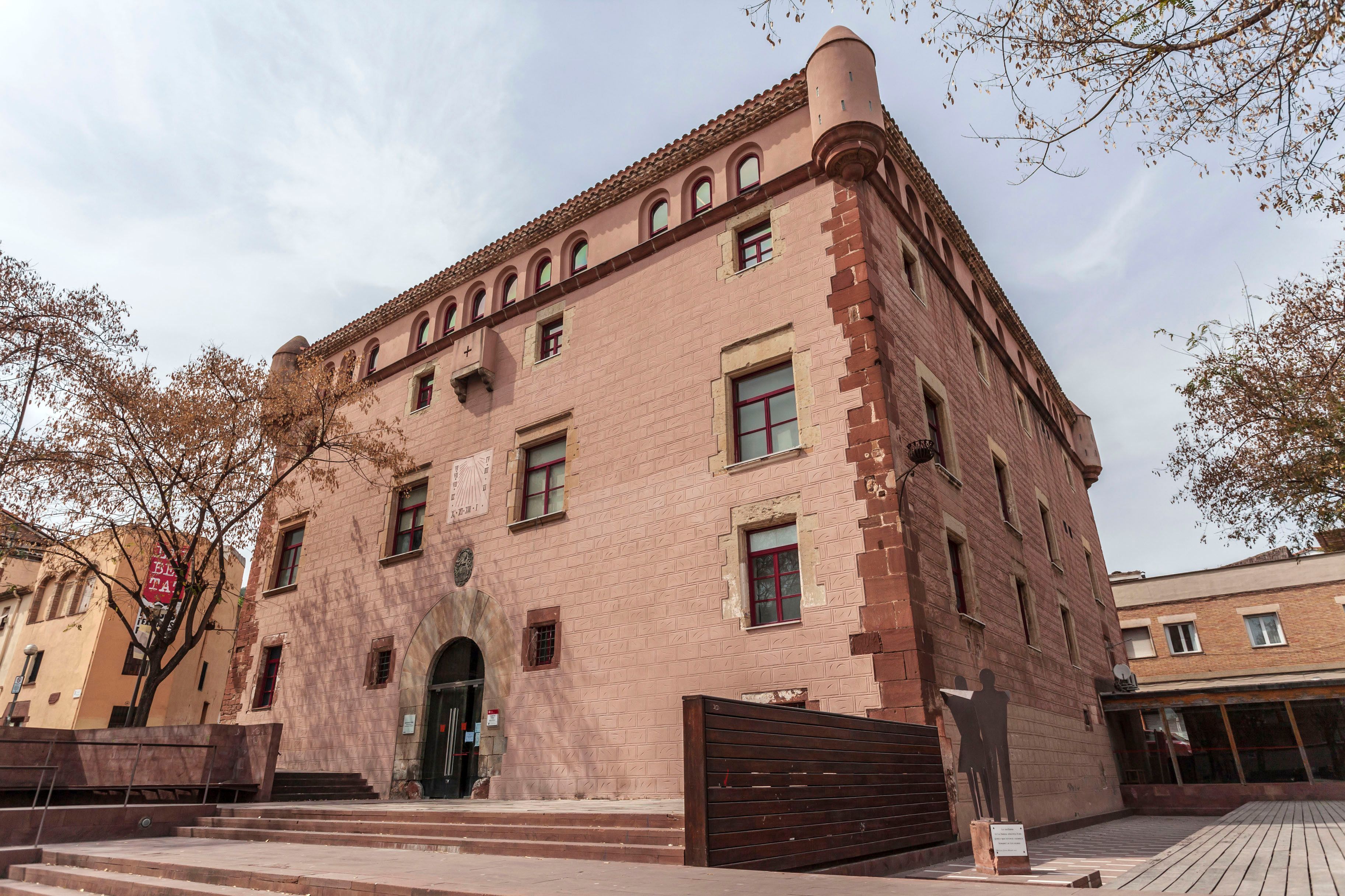 A historic building with arched windows and a brick facade.