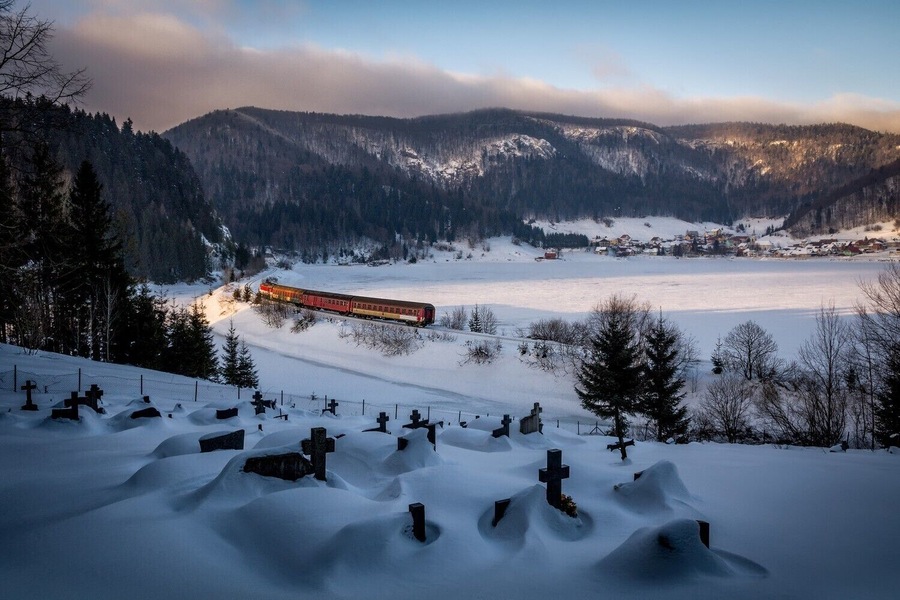 Magic winter at Dedinky. Fresh snow at cemetery, train passing by the sunset light, village and mountains in the background. This is one of my most favourite images I took,
To get similar composition just go to the cemetery near Dobsinska Masa, wait for the train and shoot :). Few time a year there are also nostalgic train rides so plan well and you can photograph this location with locomotives :)
#bvsblue