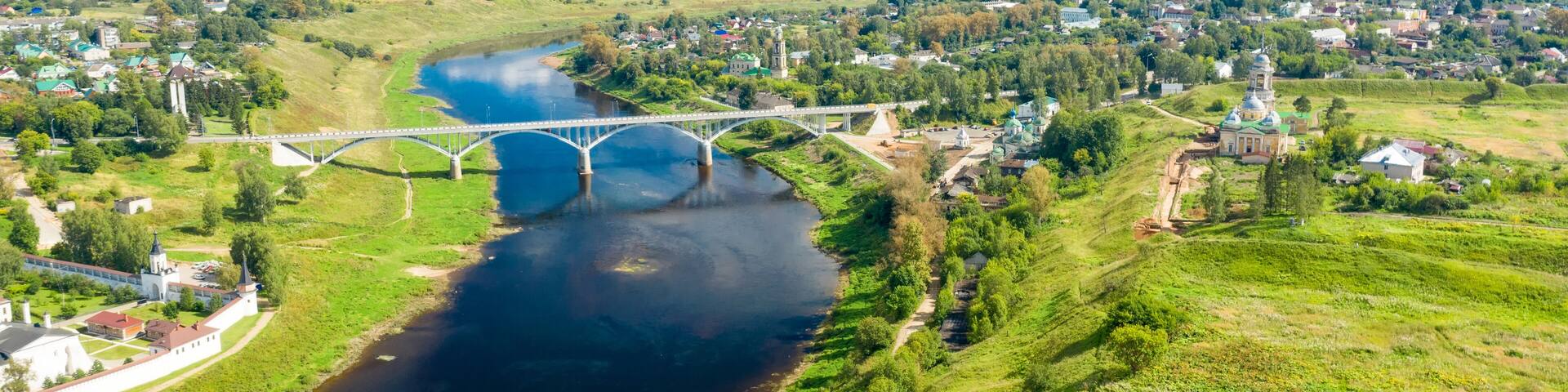 Aerial view of the Staritsa town and the road bridge over the Volga rivers