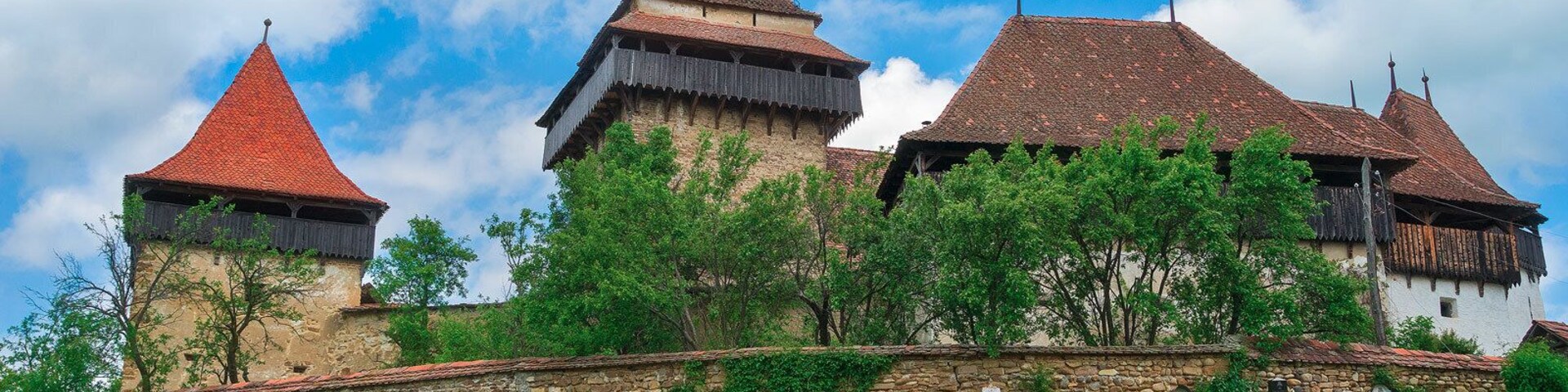 Viscri fortified church cemetery. Just around the corner past the chickens.
http://www.alwayswanderlust.com/sibiu-romania-the-heart-of-transylvania/