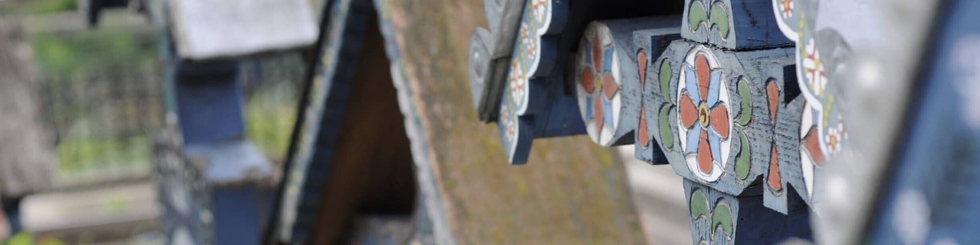 'This stillness is a big part of the Maramureş lifestyle; being able to experience it actually means understanding a way of life that has been passed on from one generation to the next and these people’s take on life is as surprising as their take on death.
The best place for us to experience that was Săpânţa, a small yet cozy village close to the Ukrainian border. What makes the inhabitants of Maramureş so special, in the end? Well, for starters, they even have a cemetery making a fool of… death. Yes, death. Stepping into the Merry Cemetery made it clear. This cemetery has mainly started as the creation of sculptor Stan Ioan Pătraş, whose legacy endured after his death, with artists who continued his beautiful work, using the same vibrant blue – the Săpânţa blue, together with other vivid colors to illustrate the resilience of the miracle of life before the big end. There are important scenes from the lives of those buried here painted on over 800 tombstones. And if this isn’t impressive enough, there are epitaphs underneath each painting summarizing the life of the deceased or depicting the circumstances of the passing, with traditional Romanian motifs found in each epitaph.'
#blue #colorful