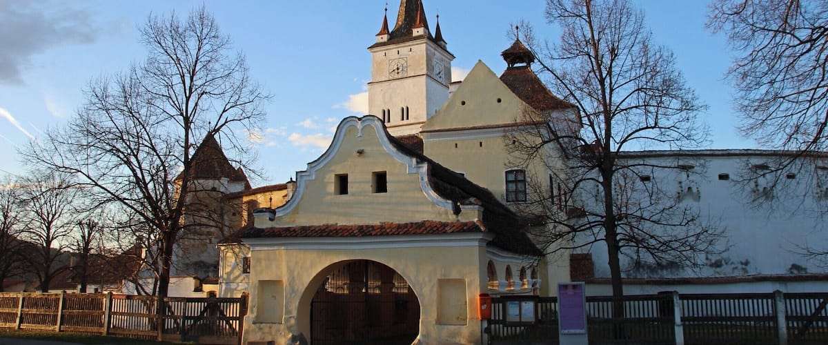 A historic church with a clock tower and a large arched entrance.