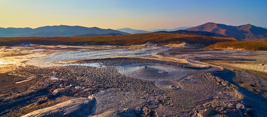 Sunrise in the Muddy Volcanoes National Reservation in Romania,Berca,Buzau,Vulcanii Noroiosi. Muddy Volcanoes landscape.