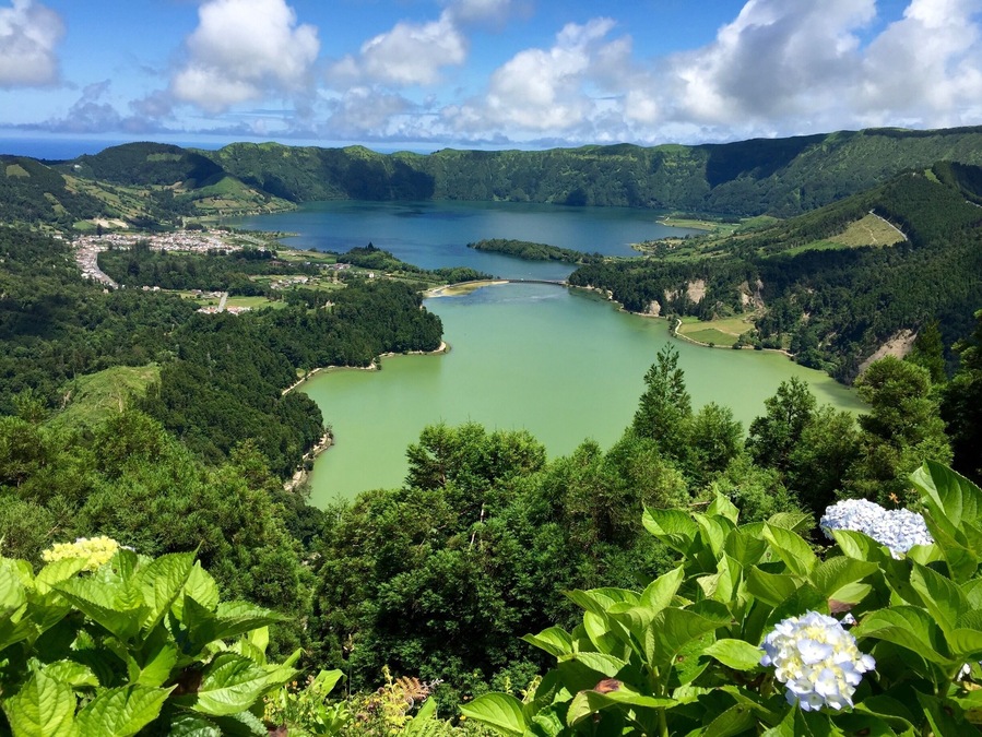 Sete Cidades is a volcanic caldera in SĂŁo Miguel Island, which is part of the Azores archipelago. We lucked out on this particular day- getting a clear, sunny picture of these beautiful lakes. Our first try on a previous day was halted by intense fog and rain. This island is fascinating in that the weather is different in every direction and changes on a whim. A great mix that helps it retain its nickname, "The Green Island" #Azores