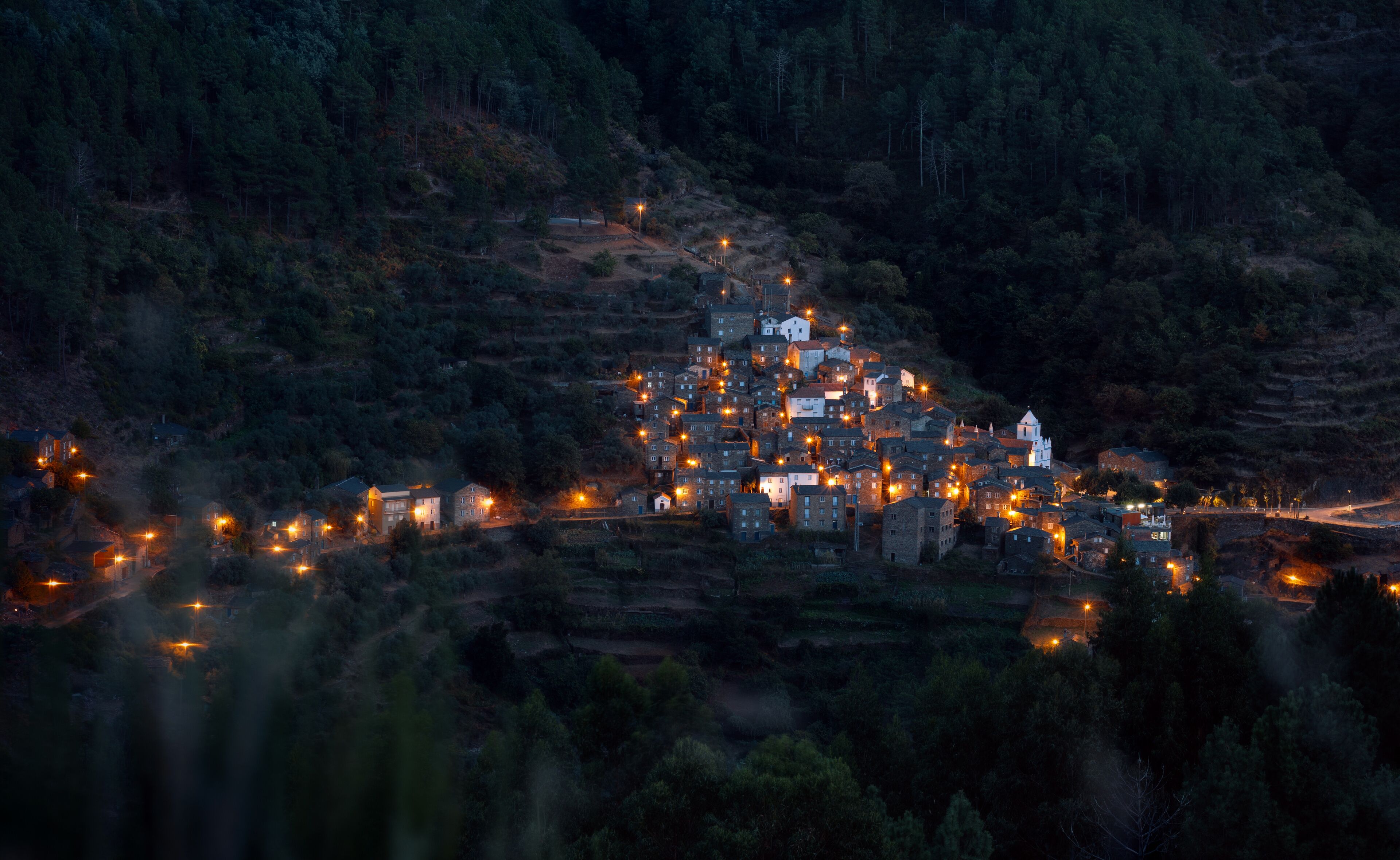 night view of the lights of small city in the mountains 
