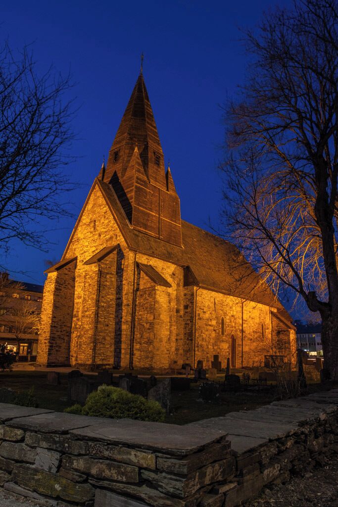 The first church here was built of wood, but it was replaced by a stone church in 1277. In a royal letter dating from 1271, King Magnus Lagabøte expressed his satisfaction that the parishioners were going to replace the wood building with a stone one, and he urged the continuation and completion of the task. When it was finished in 1277, the church was dedicated to Saint Michael. Restoration work was carried out on the church between 1919 and 1953