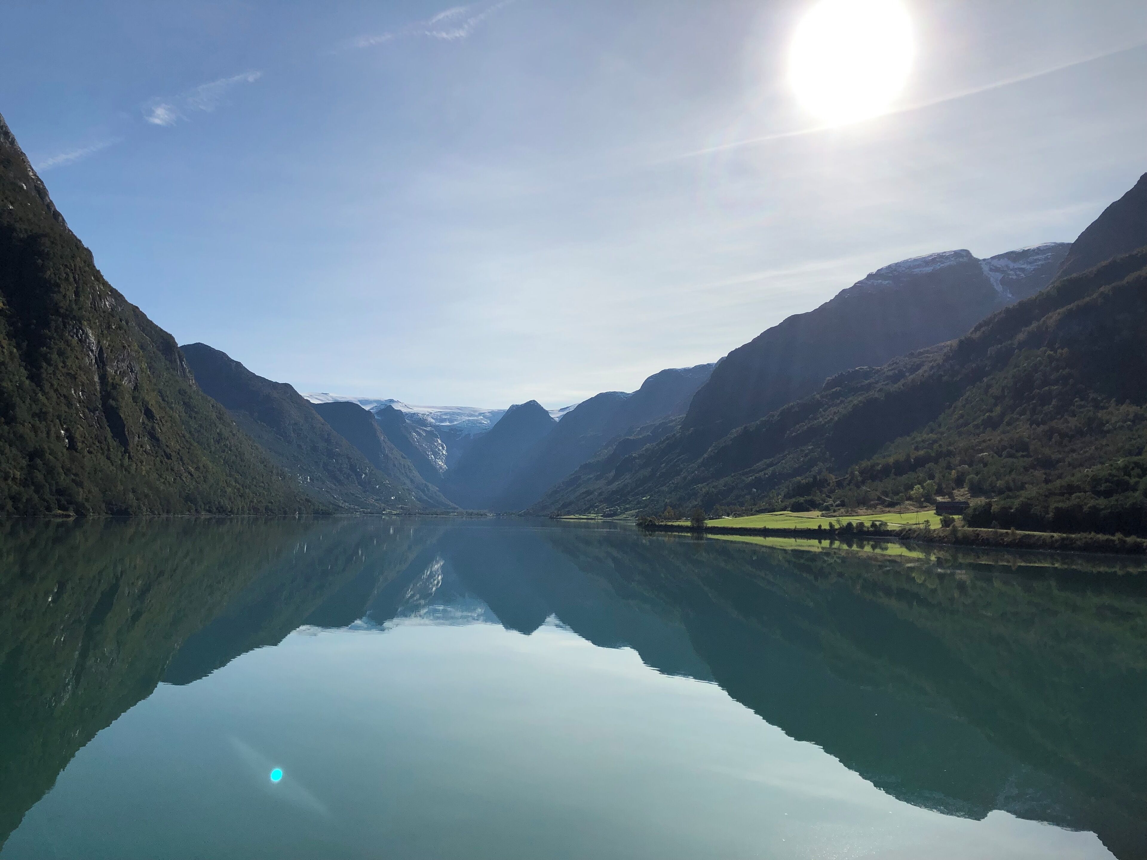 Was on a MV visiting properties along the Norwegian fjords. The landscape of water and mountains were breathtaking...you see the mountains reflect in the water and on the mountaintops snow has startedt to come back, whilst where i was standing we had around 20 degrees celsius
At the farend of the picture you see a Glacier where people from all over the world come to visit and climb