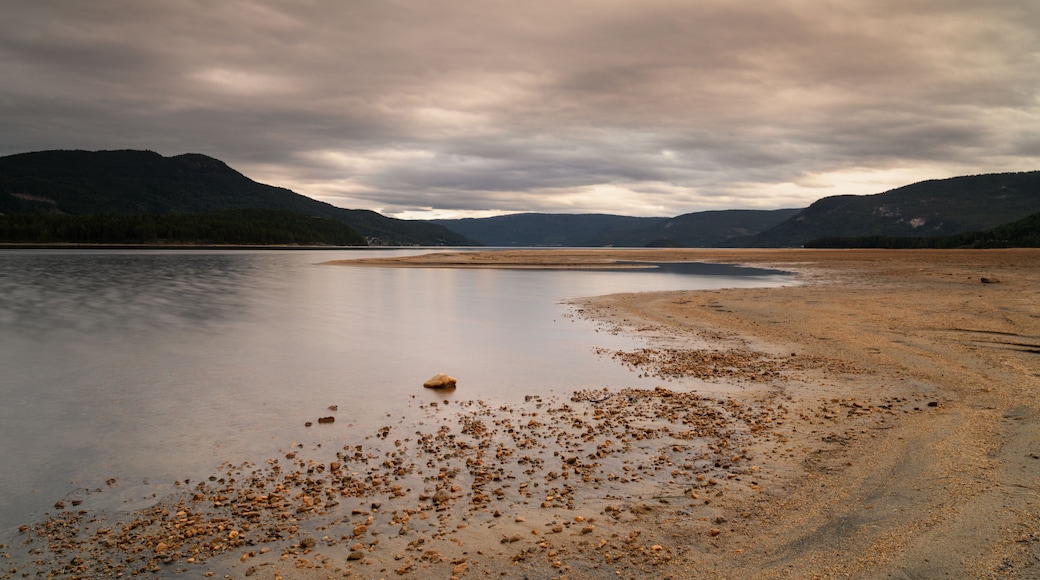 view of the beach and Fyresvatn Lake in Telemark County just before sunset