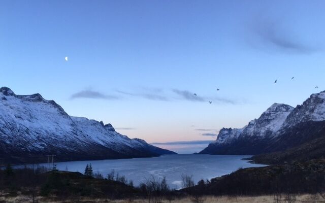 One of my favorite views.  Saw this on a Fjords tour with Chasing Lights in Tromso, Norway.  This was around 11am in the morning and you see the blue hue due to the polar night.
