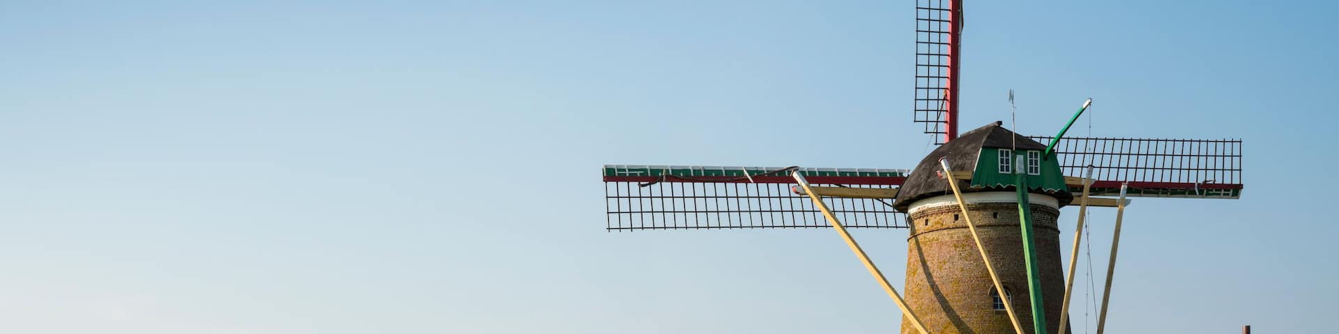 landscape with meadow and mill, Zuidzande, The Netherlands. Blue sky, space for text