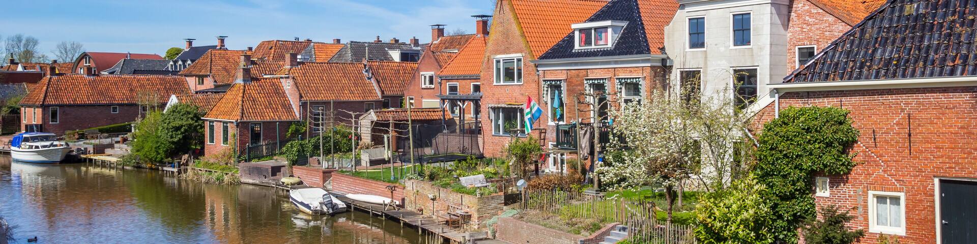 Panorama of the historic houses at the river in Winsum, Netherlands