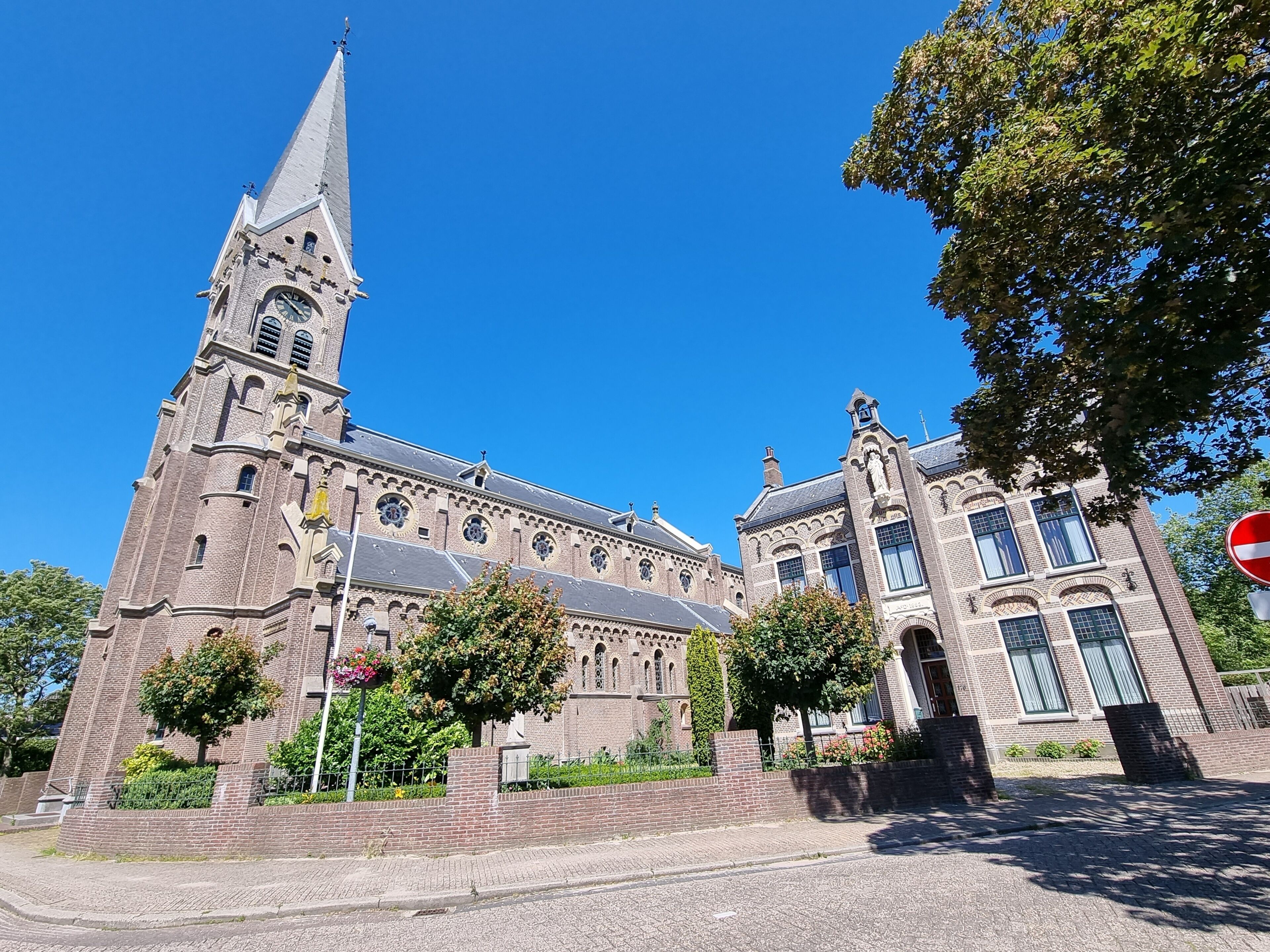The Neo-Romanesque Catholic Ursula Church and historic building in Warmenhuizen, North Holland, Holland, The Netherlands