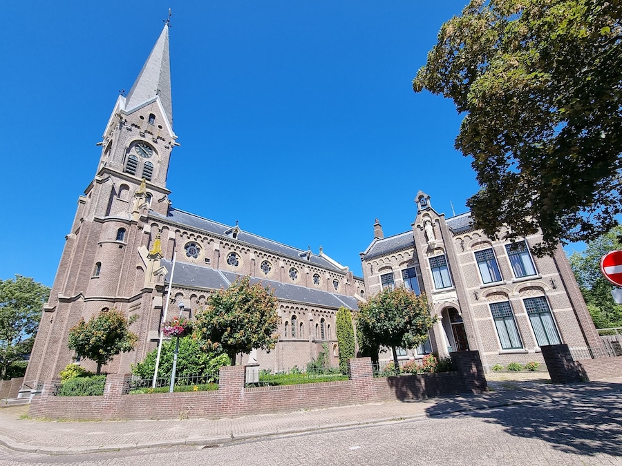 The Neo-Romanesque Catholic Ursula Church and historic building in Warmenhuizen, North Holland, Holland, The Netherlands