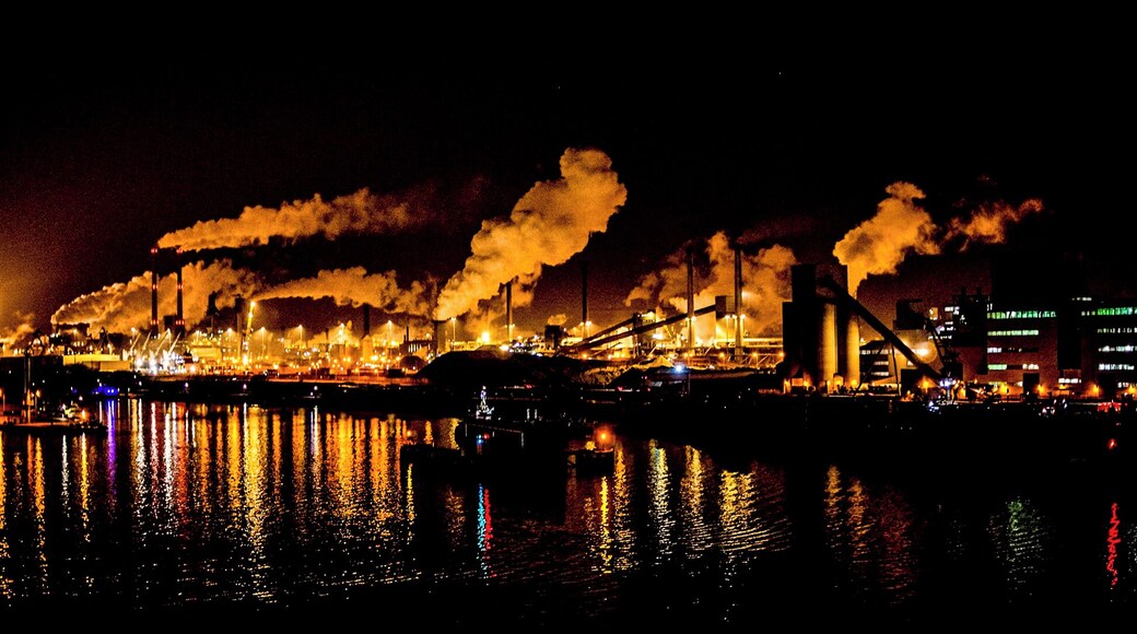 Industrial skyline of the steelwork's at night viewed from a passing cruise ship.