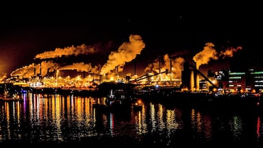 Industrial skyline of the steelwork's at night viewed from a passing cruise ship.