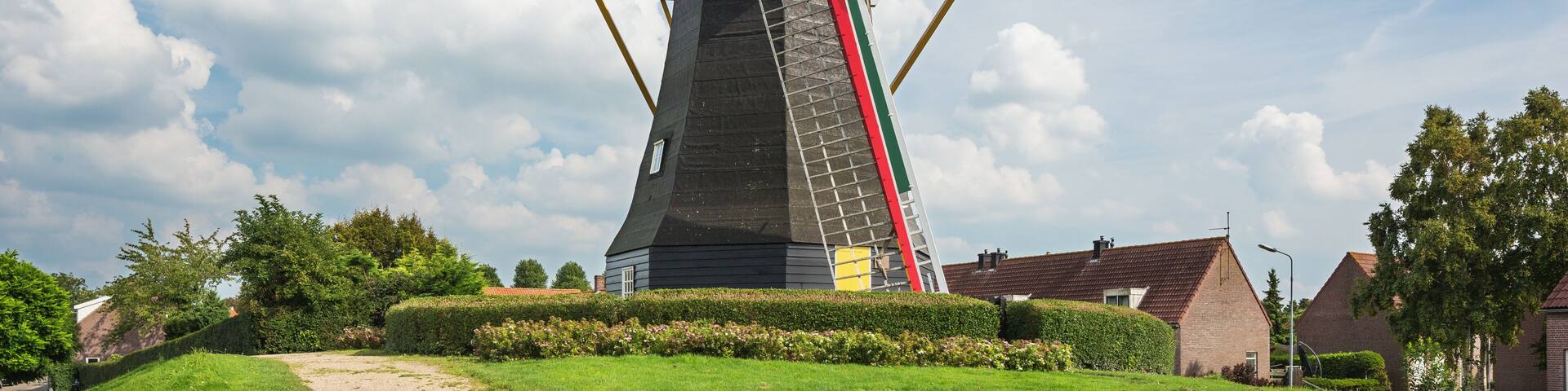 Colorful windmill Nooitgedacht in the middle of Arnemuiden