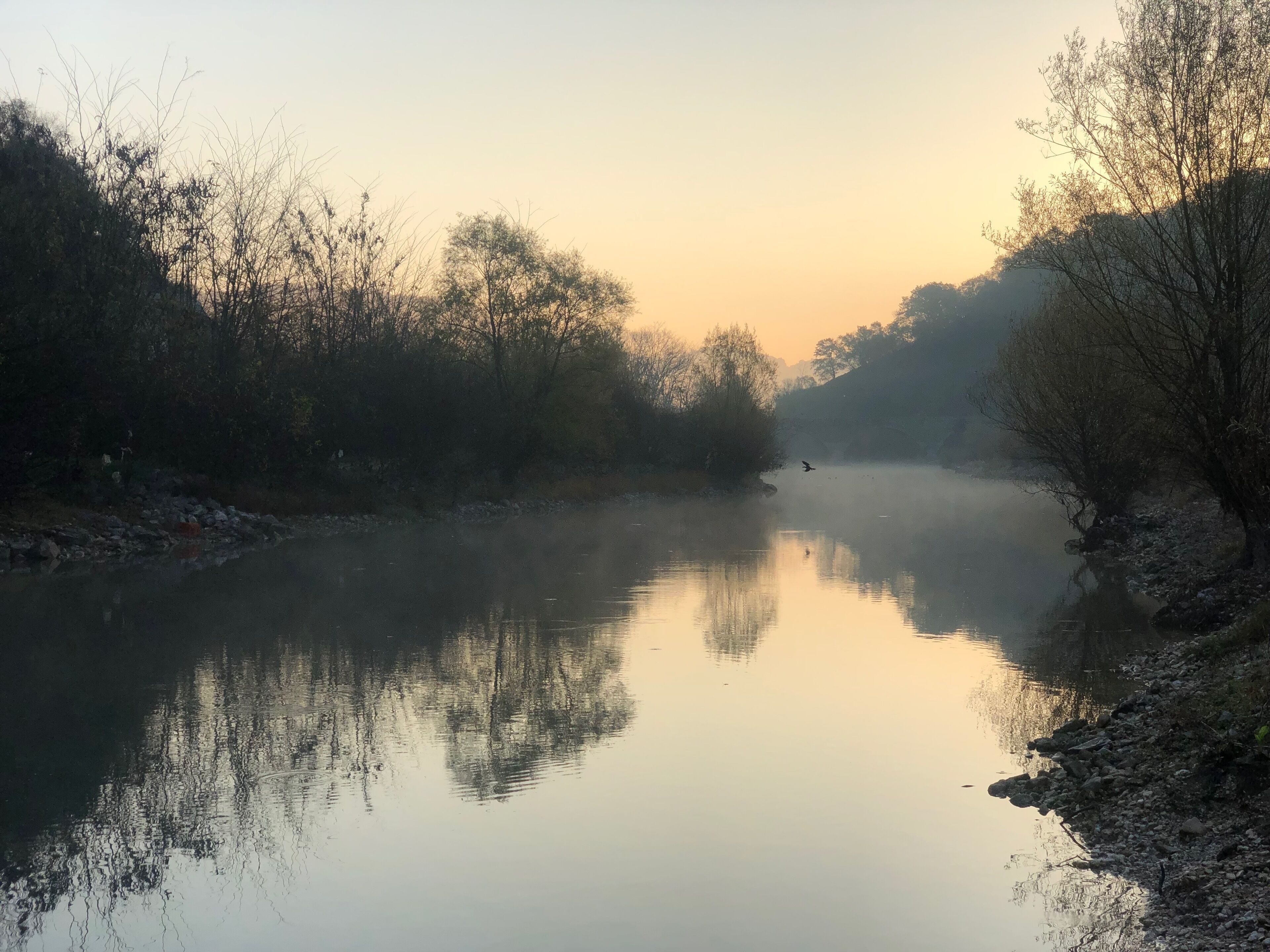 Nice view during sunrise with fog above the water 