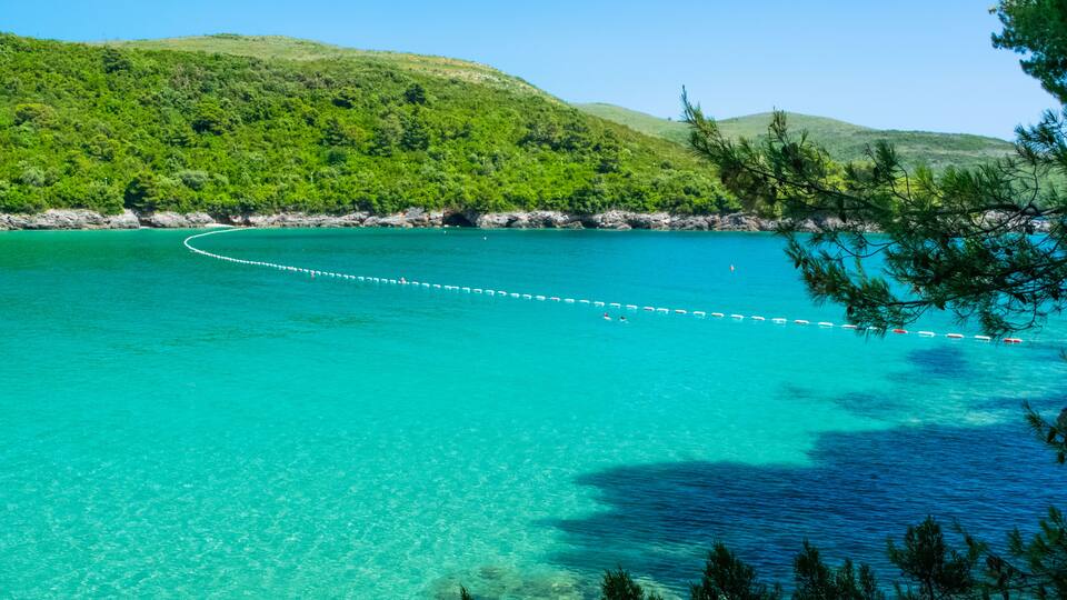 Plavi Horizonti beach landscape. Radovici. Tivat bay. Montenegro. Sandy clearest water beach excellent for kids.